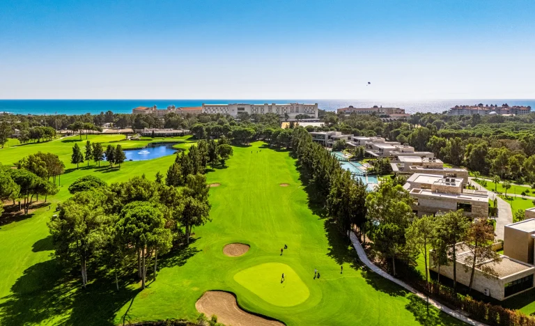 Kaya Palazzo Golf Club from the air, the fairway running down towards the sea