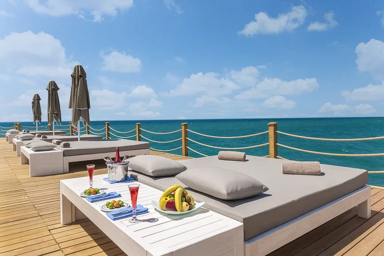 Daybeds on the wooden pier over the sea at Sirene Belek