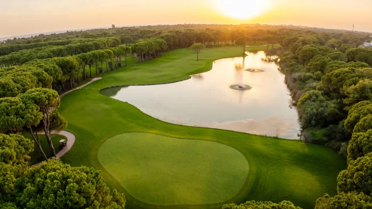 A Montgomerie green beside the lake with the fountains on