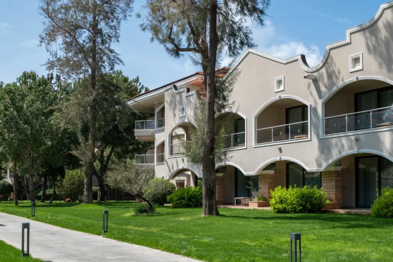 Garden accommodation blocks among the pines at Sirene Belek